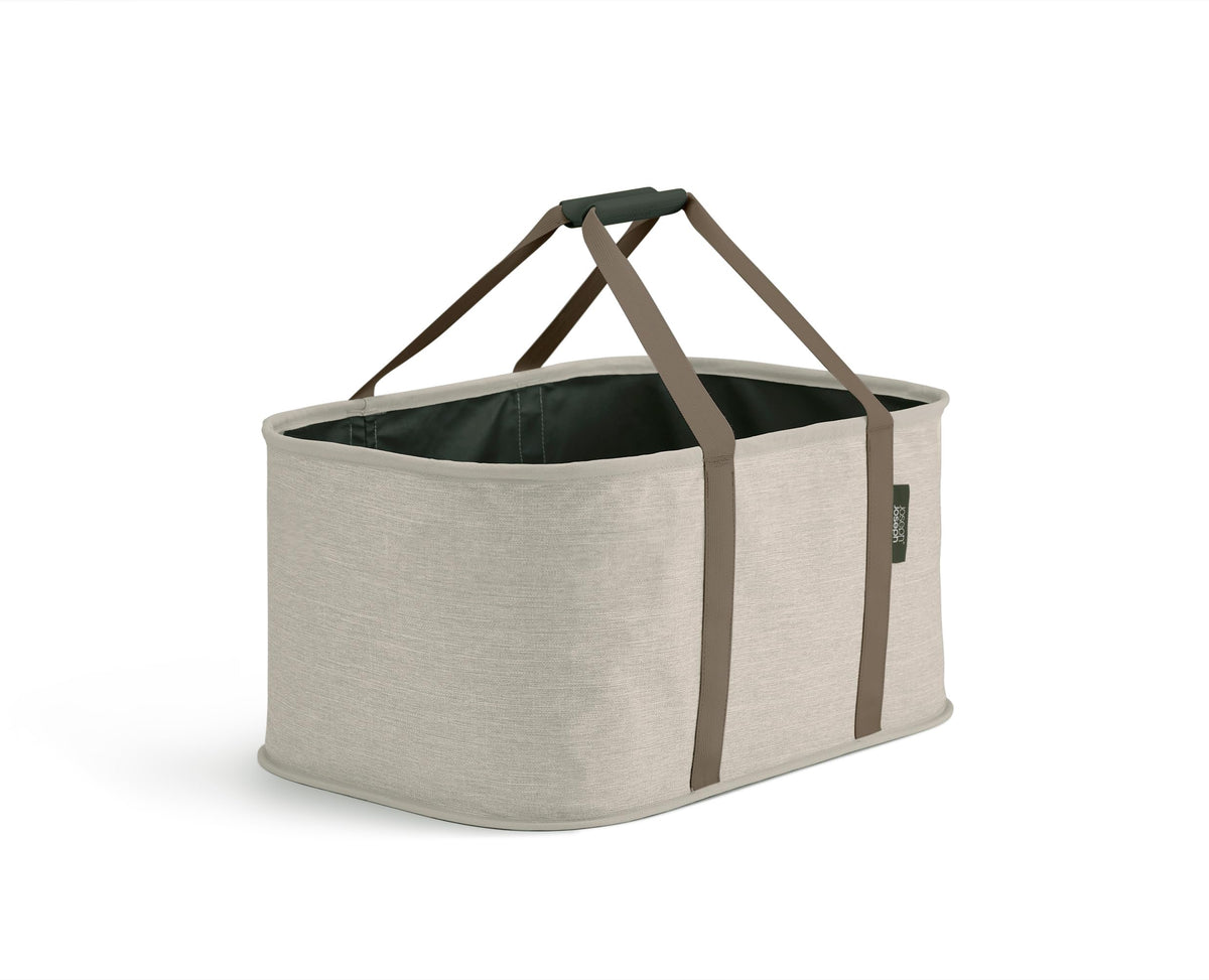 Joseph Joseph Hold-All collapsible basket 35L shown folded, ideal for small-space storage.