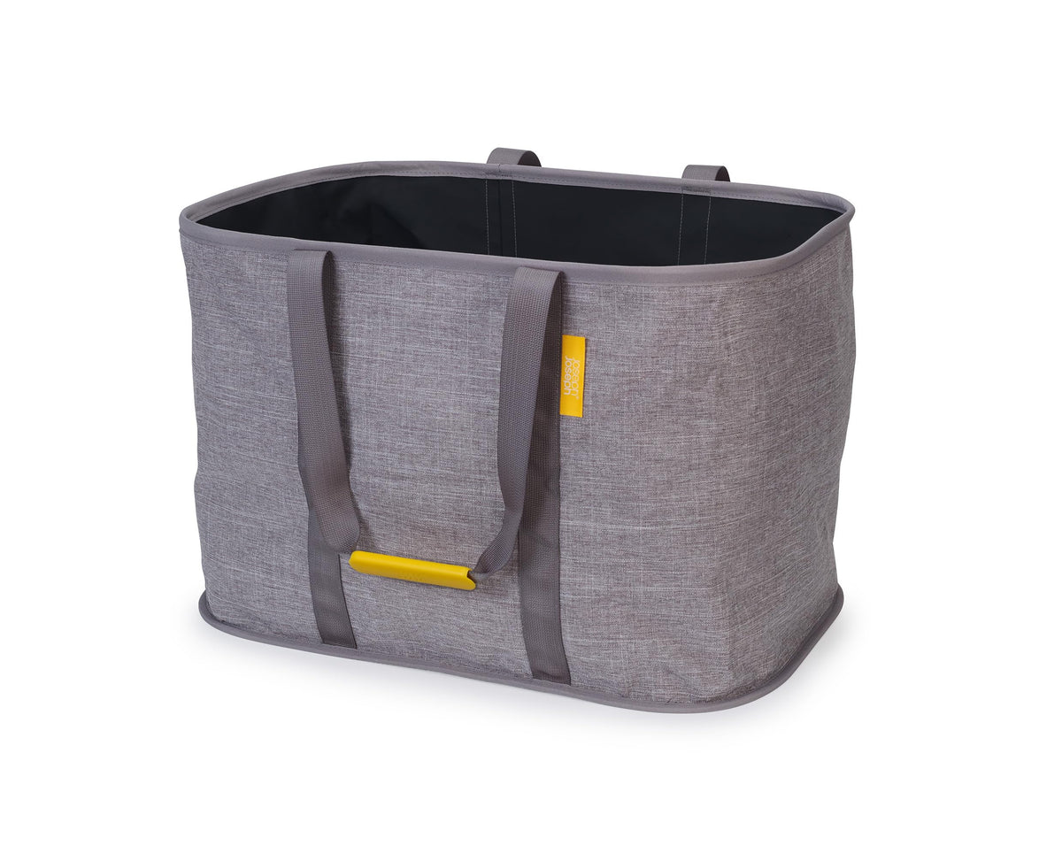 Joseph Joseph Hold-All Max folded-flat laundry basket for easy storage.
