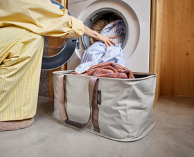 Joseph Joseph Hold-All interior lining resists moisture for damp clothes.