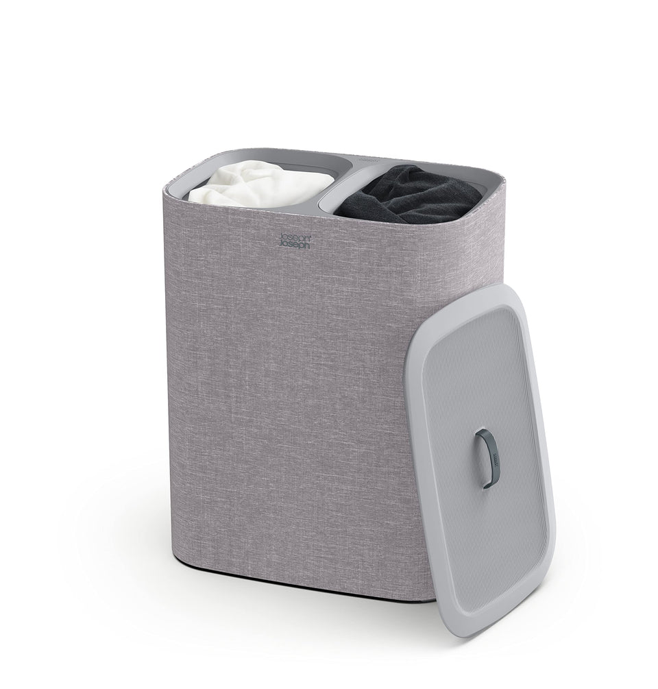 Joseph Joseph Tota basket with lid in gray fabric promotes organized laundry storage.