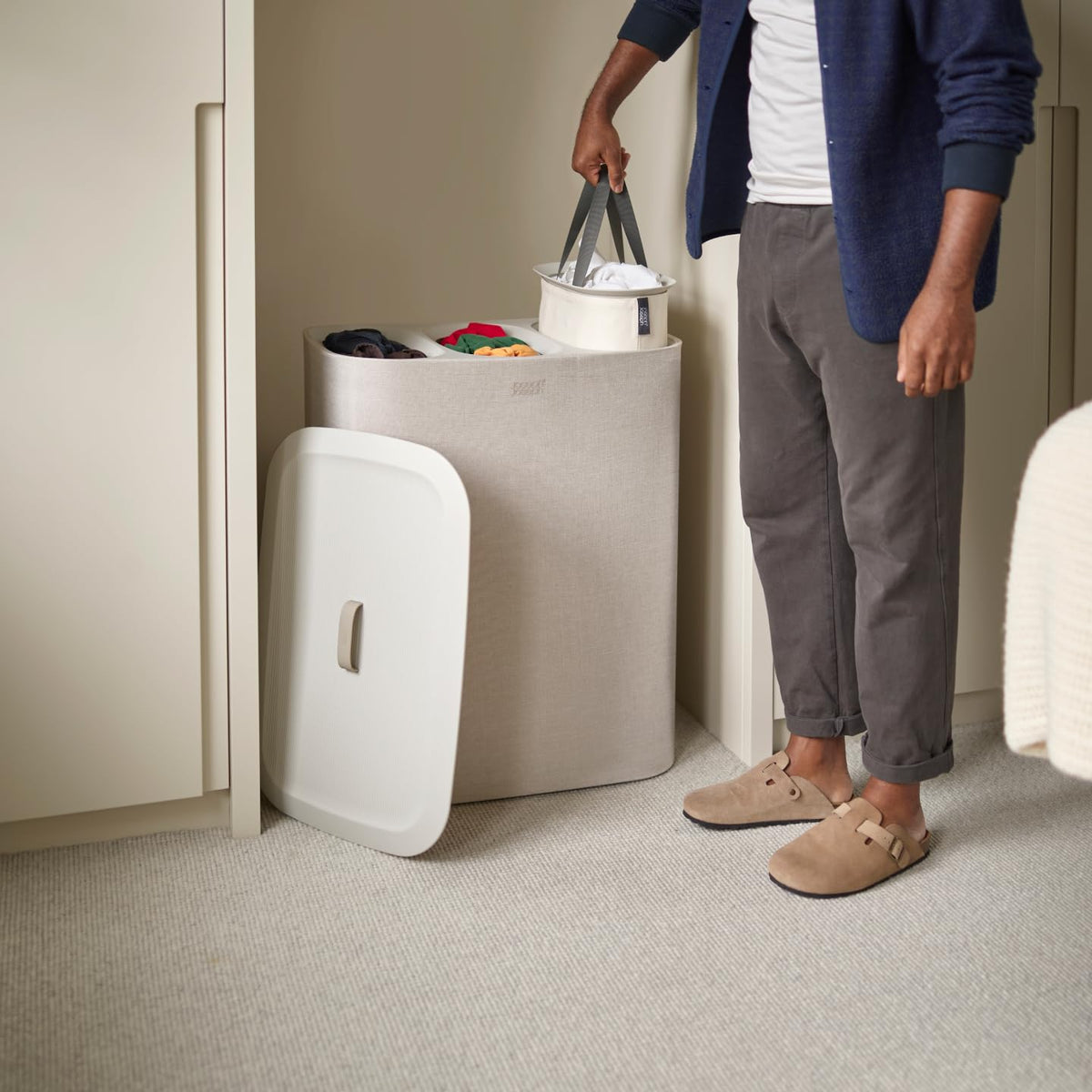 Joseph Joseph Tota Trio base bag handles simplify emptying during laundry load.