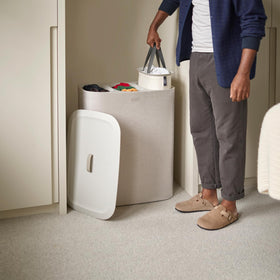 Joseph Joseph Tota Trio base bag handles simplify emptying during laundry load.