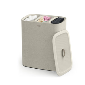 Joseph Joseph Tota Trio laundry hamper lid keeps laundry organized and concealed.