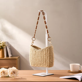 Josmimic adjustable purse display adapts to different bag sizes with stability.