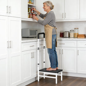 Josmimic step stool with adjustable handle for varied user heights.