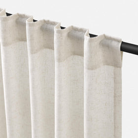 Jowels natural linen curtains with light filtering create a warm living room glow.