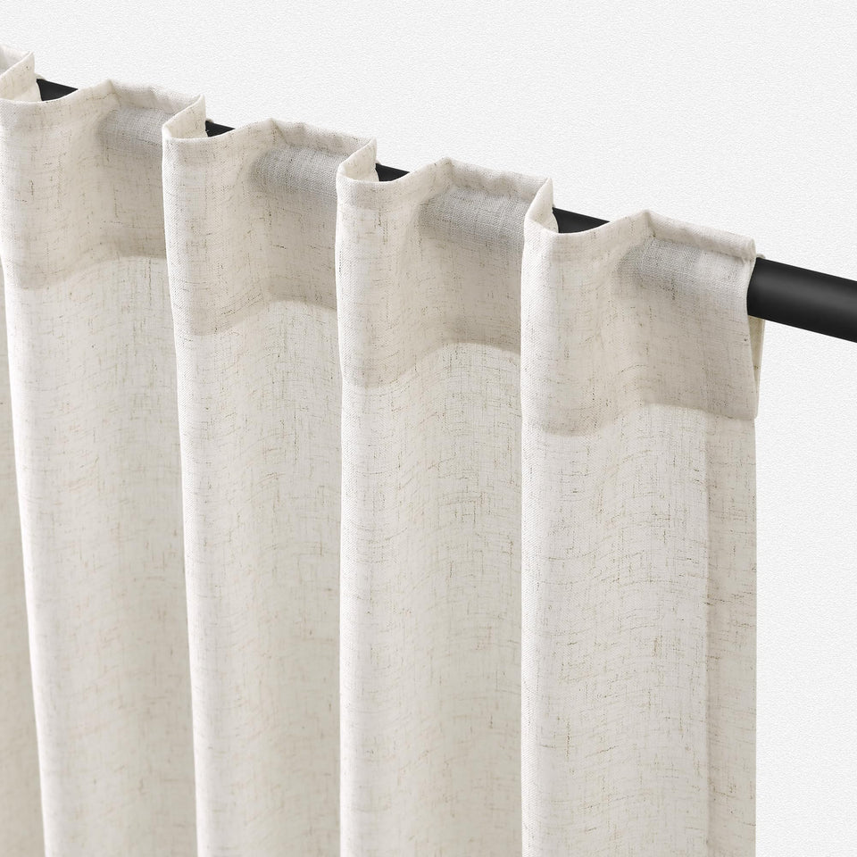 Jowels natural linen curtains with light filtering create a warm living room glow.