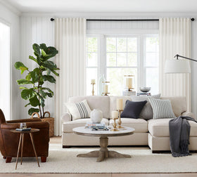 Jowels ivory linen curtains showcase pinch pleated look for elegant windows.