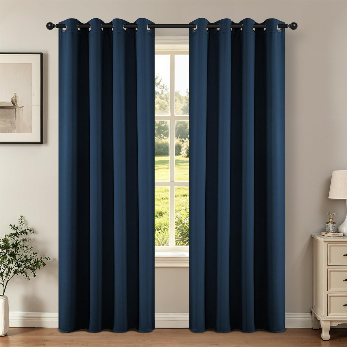 Joydeco navy blackout curtain panel on rod provides room-dimming style.