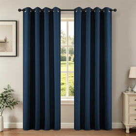 Joydeco navy blackout curtain panel on rod provides room-dimming style.
