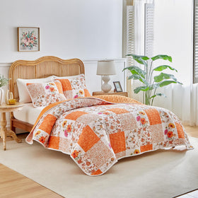 Joyreap orange-white flower design quilt showcases all-season comfort in microfiber.