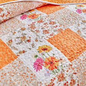 Joyreap queen patchwork quilt enhances cozy bedroom ambiance.