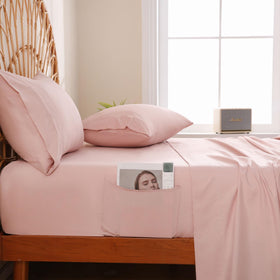 JSD Dusty Pink bedroom scene showcasing a cozy, inviting bed setup.