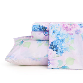 JSD Purple Hydrangea pattern on a queen bed adds stylish decor and cozy comfort.