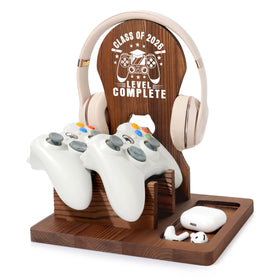 JSENGIFT Class of 2026 wood headphone stand on a desk keeps headphones neatly organized.