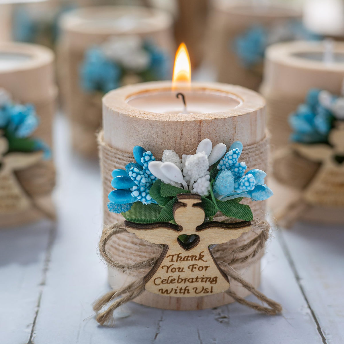 Ju's Favors baptism gift tea light holder adds warmth to the table.