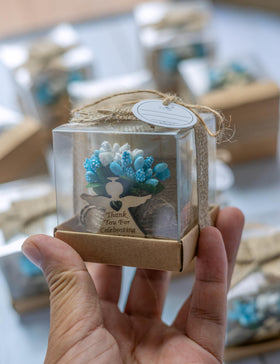 Ju's Favors light brown blue tealight holder complements various themes.