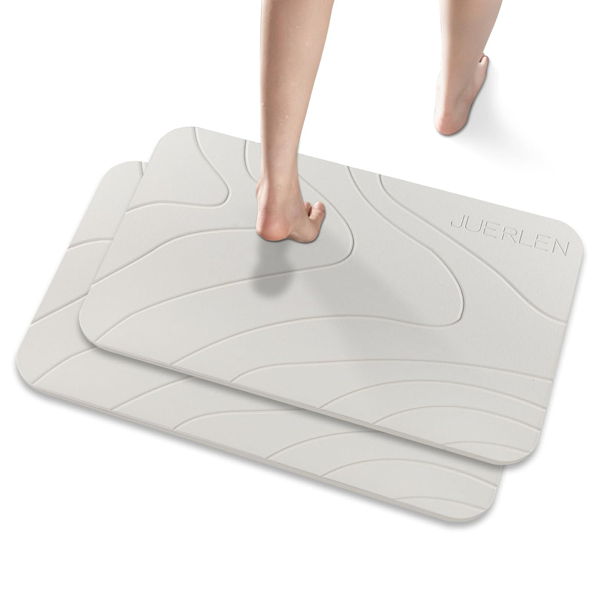 JUERLEN diatomaceous earth shower mat with stone design absorbs water quickly.