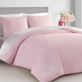 Juicy Couture package-ready set with matching shams on a luxe bed setup