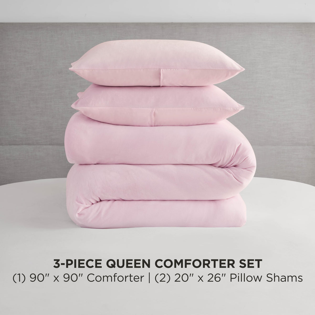 Juicy Couture marshmallow pink velour comforter set folded, showcasing plush texture and soft warmth