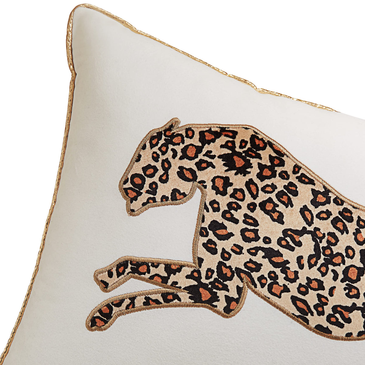 Juicy Couture pillow resting on a bed enhances glam bedroom vibe