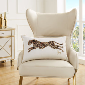 Juicy Couture pillow shines on a sofa as a luxurious accent