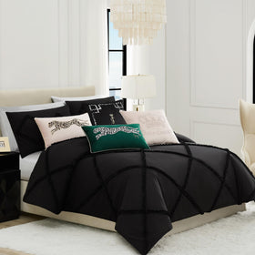Juicy Couture pillow styled on a sofa for stylish living room decor