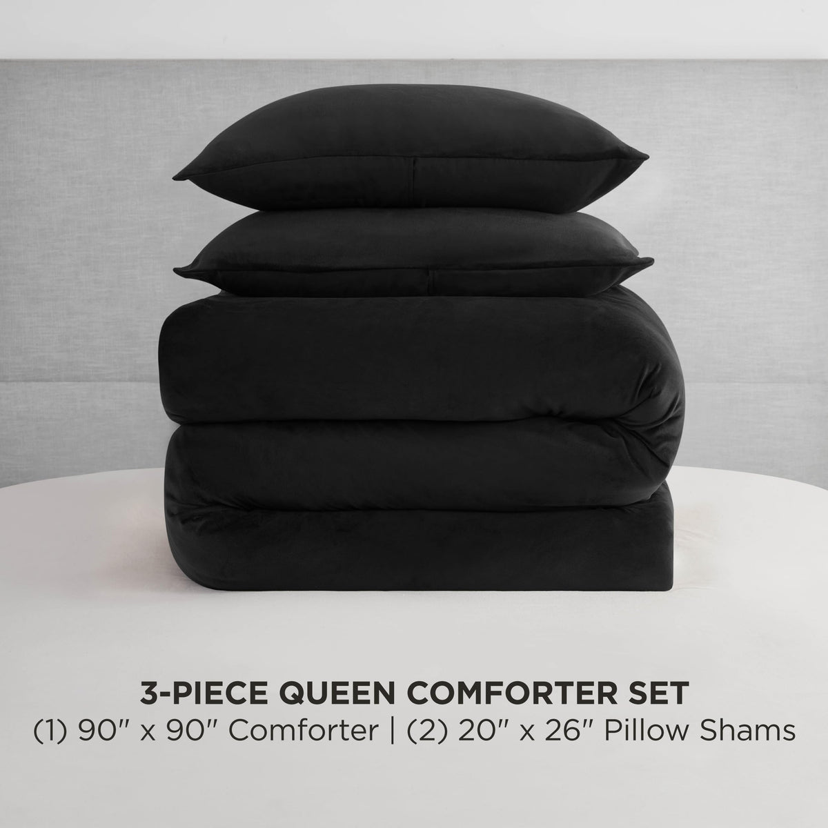 Juicy Couture velour comforter close up with rhinestone logo detail.