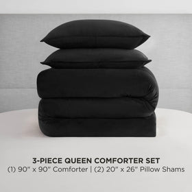 Juicy Couture velour comforter close up with rhinestone logo detail.