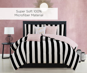 Juicy Couture Cabana Stripe bed scene showcasing bold black-and-white styling with pink accent.