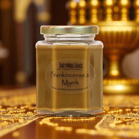 Just Makes Scents 8oz frankincense and myrrh candle in decorative jar.