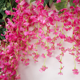 JUSTOYOU wisteria garland features 12 faux heads for colorful focal points.