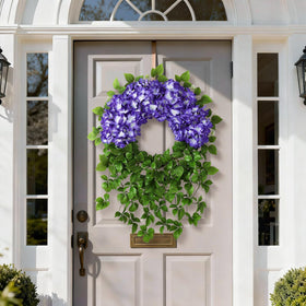 Close-up of lifelike petals and purple hue on Juxdp wreath