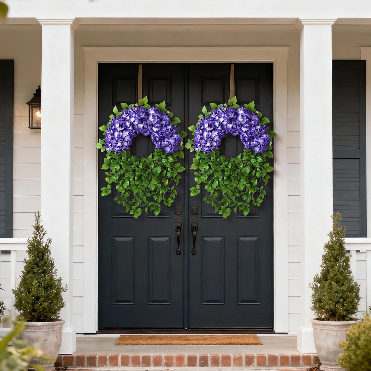 Juxdp wreath displayed on a mantel in purple shades