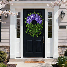 Weather‑resistant Juxdp wreath standing up to sun and rain outdoors
