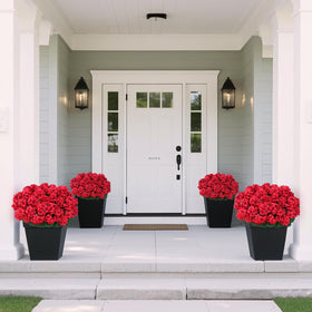 Juxdp artificial geraniums showcased on front porch planters.