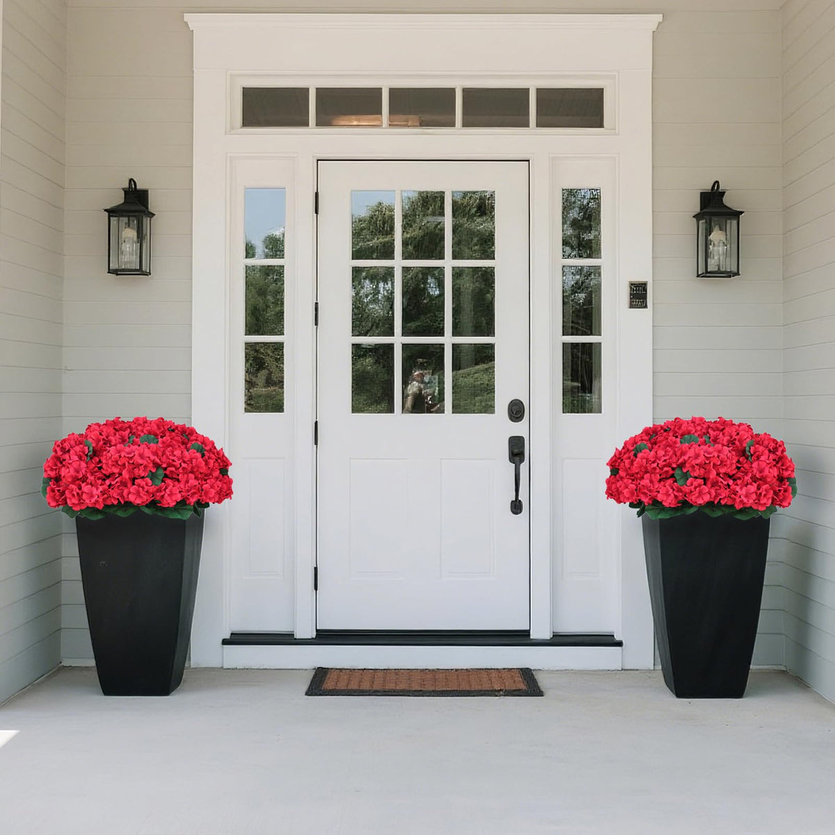 Two weighted pots stabilize the Juxdp topiaries on steps.