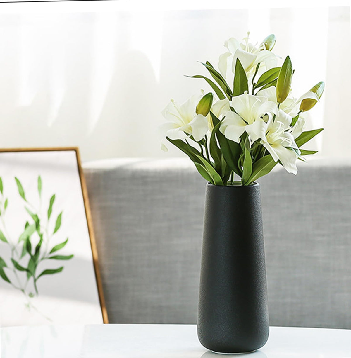 JUZAI sculptural vase serves as a striking focal point on any table.