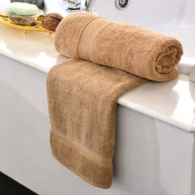 Towels from KAHAF COLLECTION displaying soft plush texture and color richness