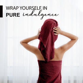 KAHAF COLLECTION 24x48 burgundy towel highlights quick-dry performance after a shower.