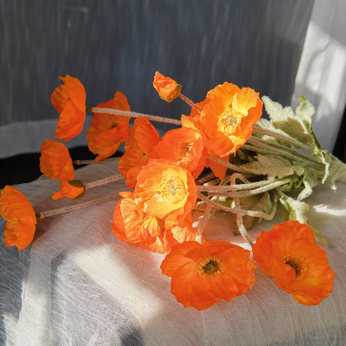 Kainonnan orange silk poppies used in wedding décor ideas in natural light.