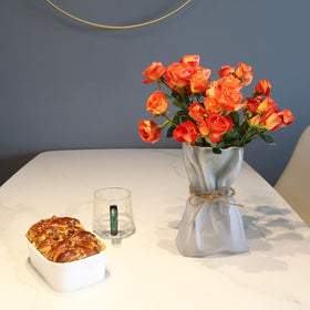 Kaitnax vase with dried or faux florals on display.
