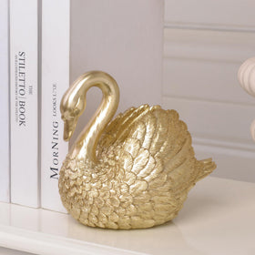 Kakizzy Swan home decor for shelves and book collections.