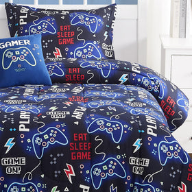 Kaleido Space glow decor pillow adds luminous flair to kid's bed setup.