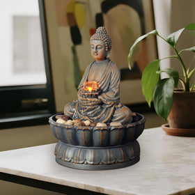 Kalona Buddha fountain in serene sitting pose for calming spaces.