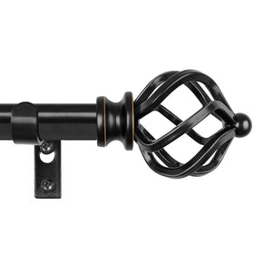 KAMANINA black curtain rod with twisted cage finials brightens a modern living room.