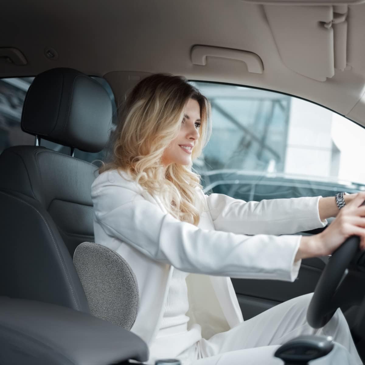 Kasney lumbar pillow on a car seat illustrating versatile back relief