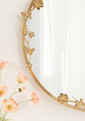 Rosella bathroom vanity mirror reflects light with gold luxe finish.