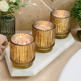 Kate Aspen gold votive set arranged as festive centerpiece.