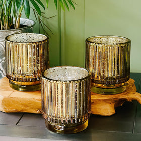Kate Aspen ribbed votives grouped on a tray for wedding decor.